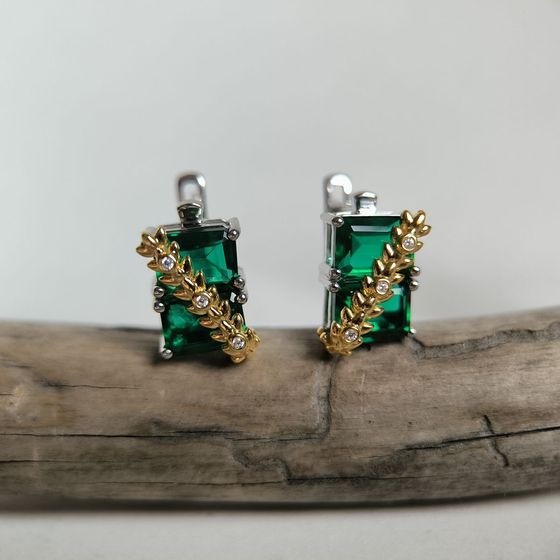 Silver earrings with a 5.963-carat nano emerald