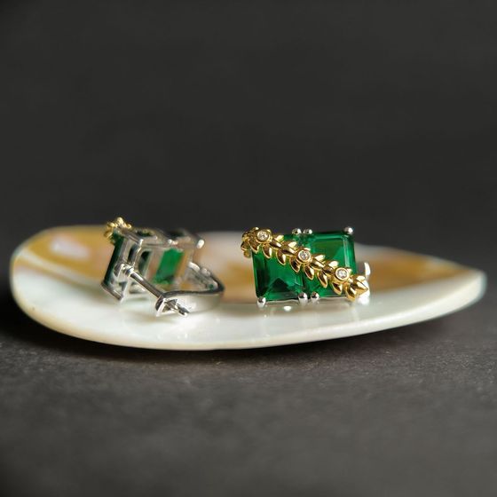 Silver earrings with a 5.963-carat nano emerald
