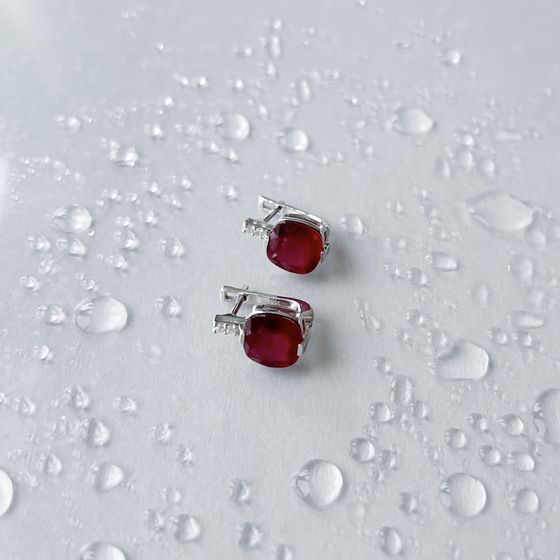Silver earrings with a ruby