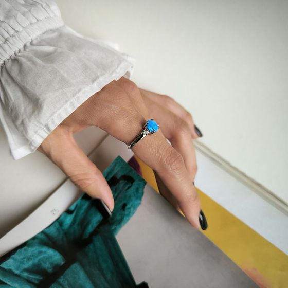 Silver ring with a 1.067-carat opal and cubic zirconia