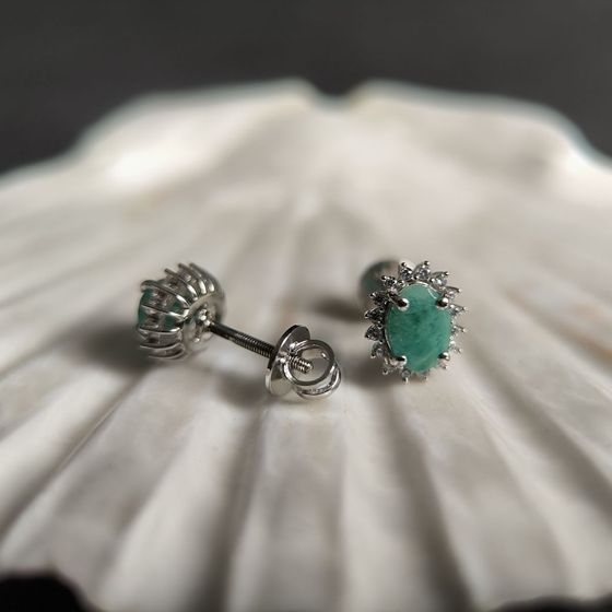 Silver earrings with a 1.814-carat emerald and cubic zirconia