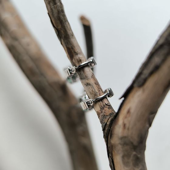 Silver earrings with a 1.892-carat nano emerald