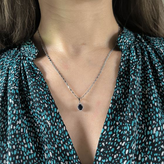 Silver pendant with a 1.098-carat sapphire and cubic zirconia