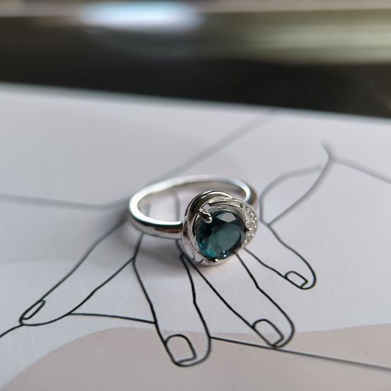 Silver ring with a London Blue topaz and cubic zirconia