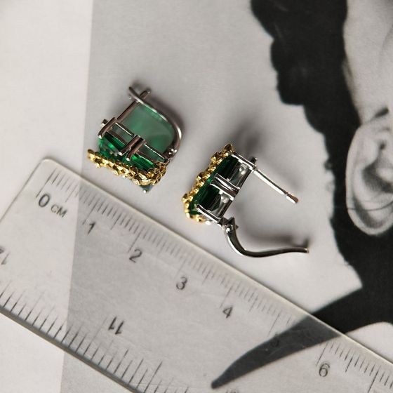 Silver earrings with a 5.963-carat nano emerald