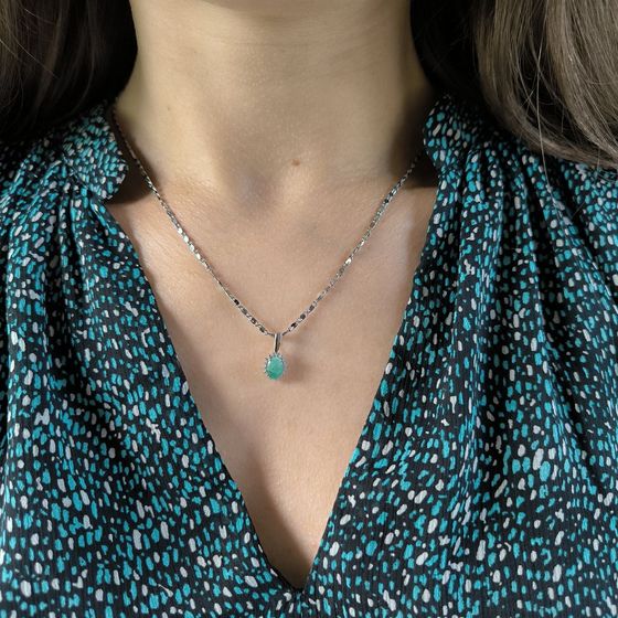 Silver pendant with emerald, fianites