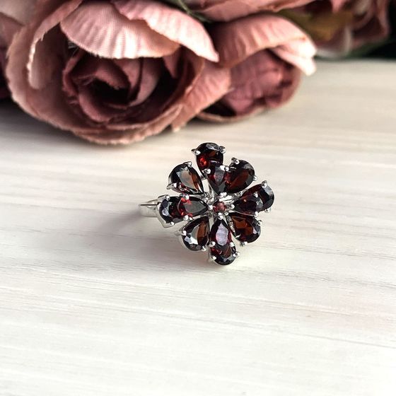 Silver ring with a garnet