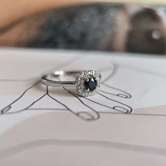 Silver ring with a 0.525-carat sapphire and cubic zirconia