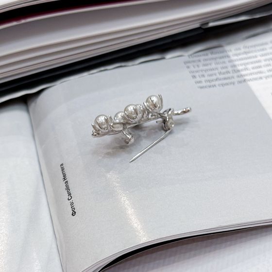 Silver brooch with pearls
