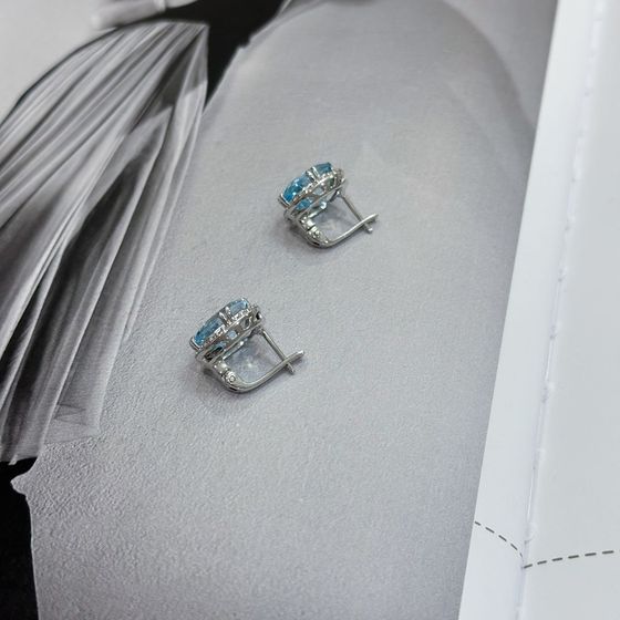 Silver earrings with a 12.432-carat topaz and cubic zirconia