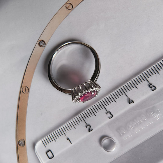 Silver ring with ruby, fianites