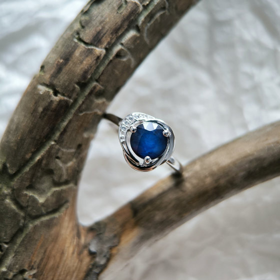 Silver ring with a sapphire and cubic zirconia
