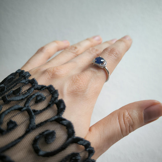 Silver ring with a sapphire and cubic zirconia