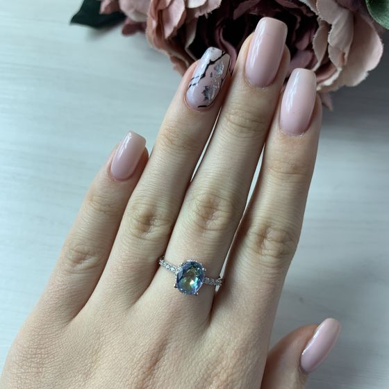 Silver ring with a mystic topaz