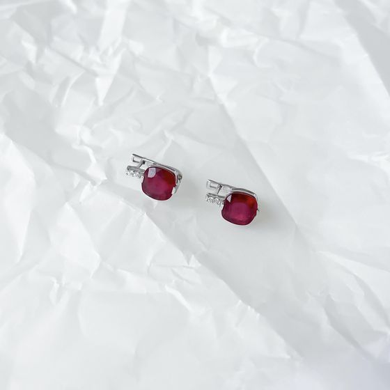 Silver earrings with a ruby