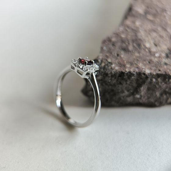 Silver ring with a 0.464-carat garnet and cubic zirconia