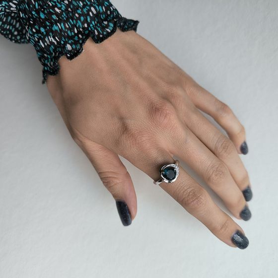 Silver ring with a London Blue topaz and cubic zirconia