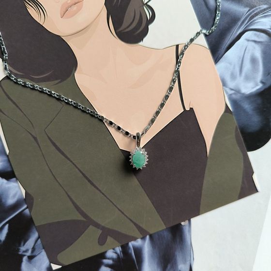 Silver pendant with a 0.907-carat emerald and cubic zirconia