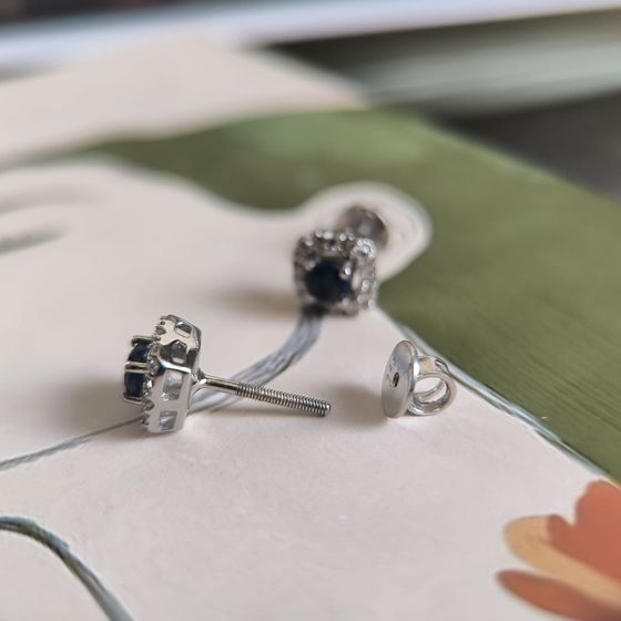 Silver earrings with a 1.028-carat sapphire and cubic zirconia
