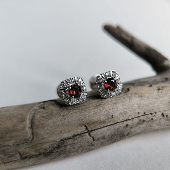 Silver earrings with a 0.949-carat garnet and cubic zirconia